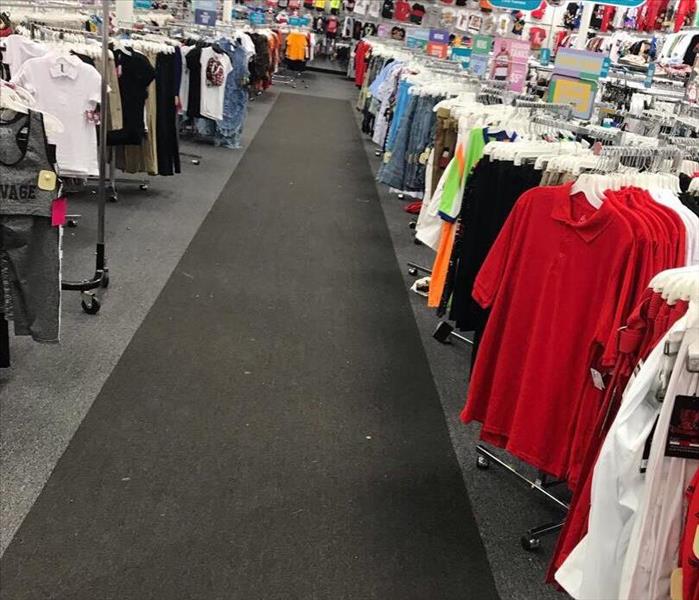 Restored carpet in retail store after flood